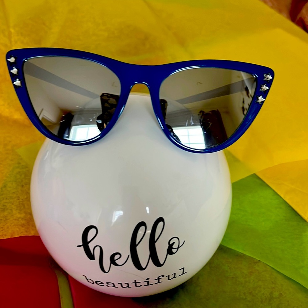 Red and blue cat eye framed sunglasses